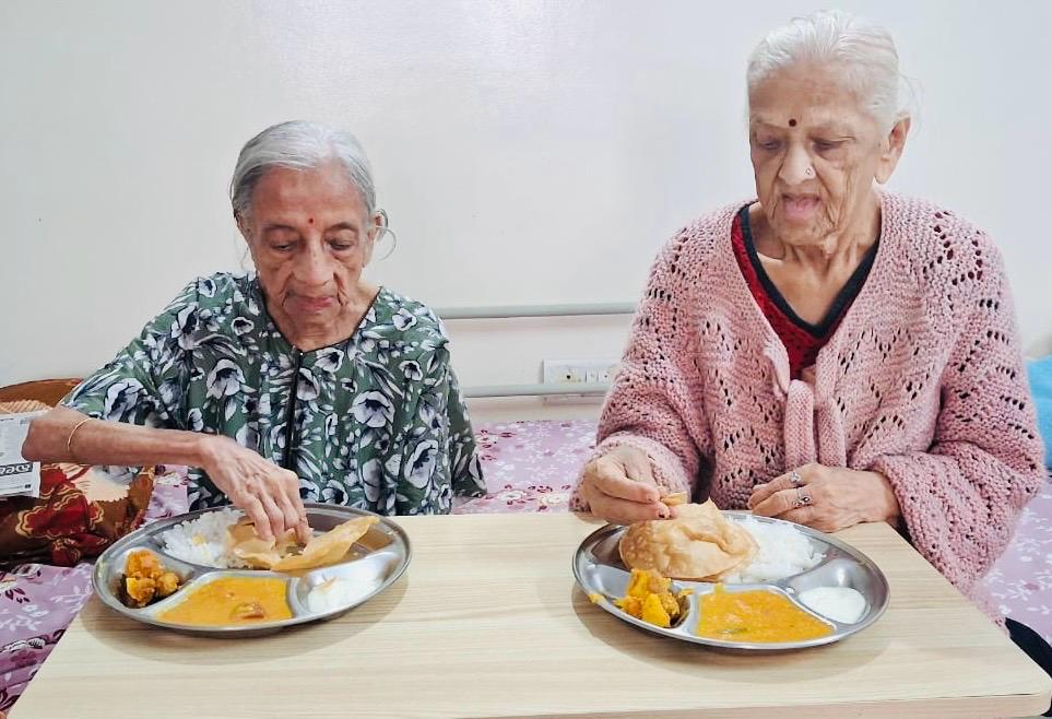 Senior residents enjoying a meal at Bangalore Care Takers