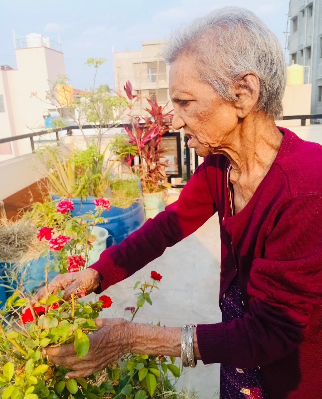 Senior resident enjoying gardening at Bangalore Care Takers